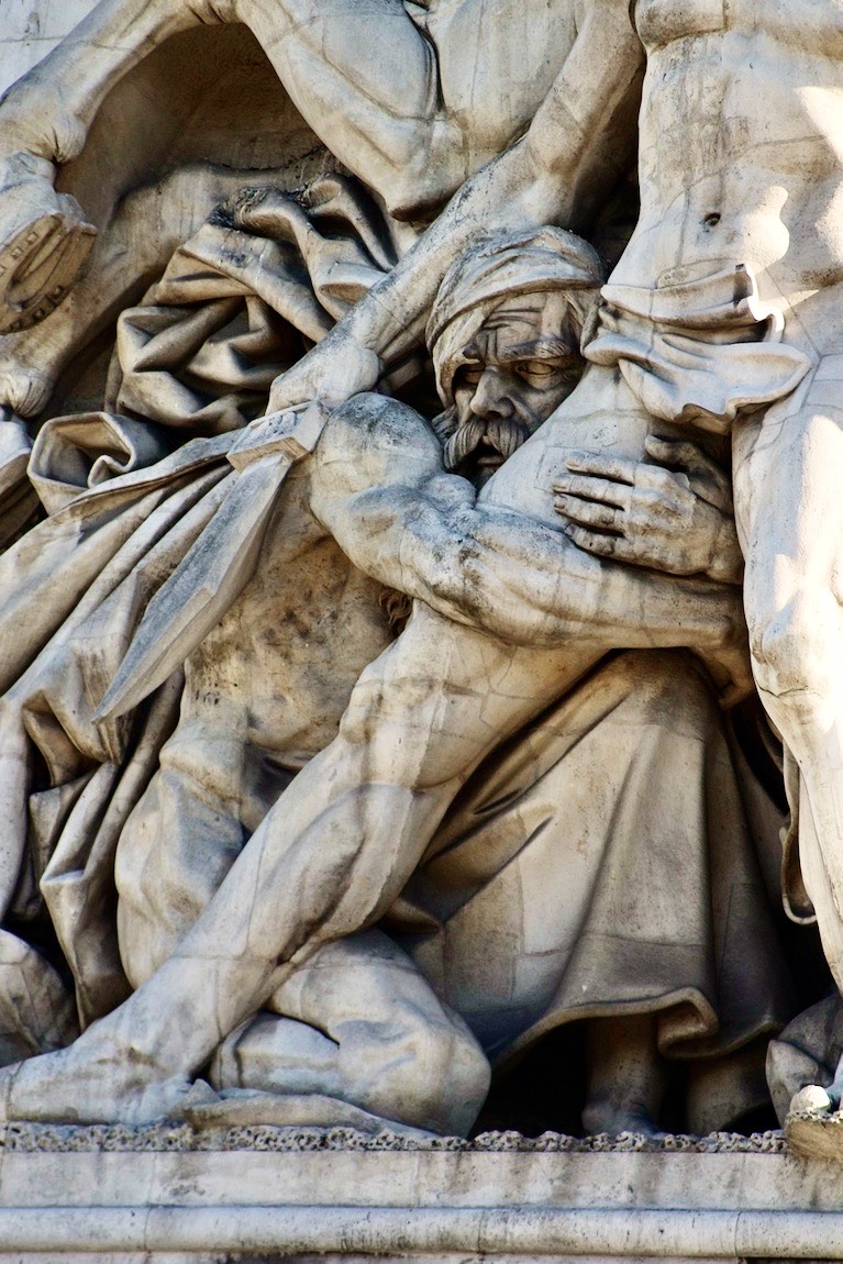 Detail of the Arc de Triomphe.  This soldier must have had enough. Who can blame him?